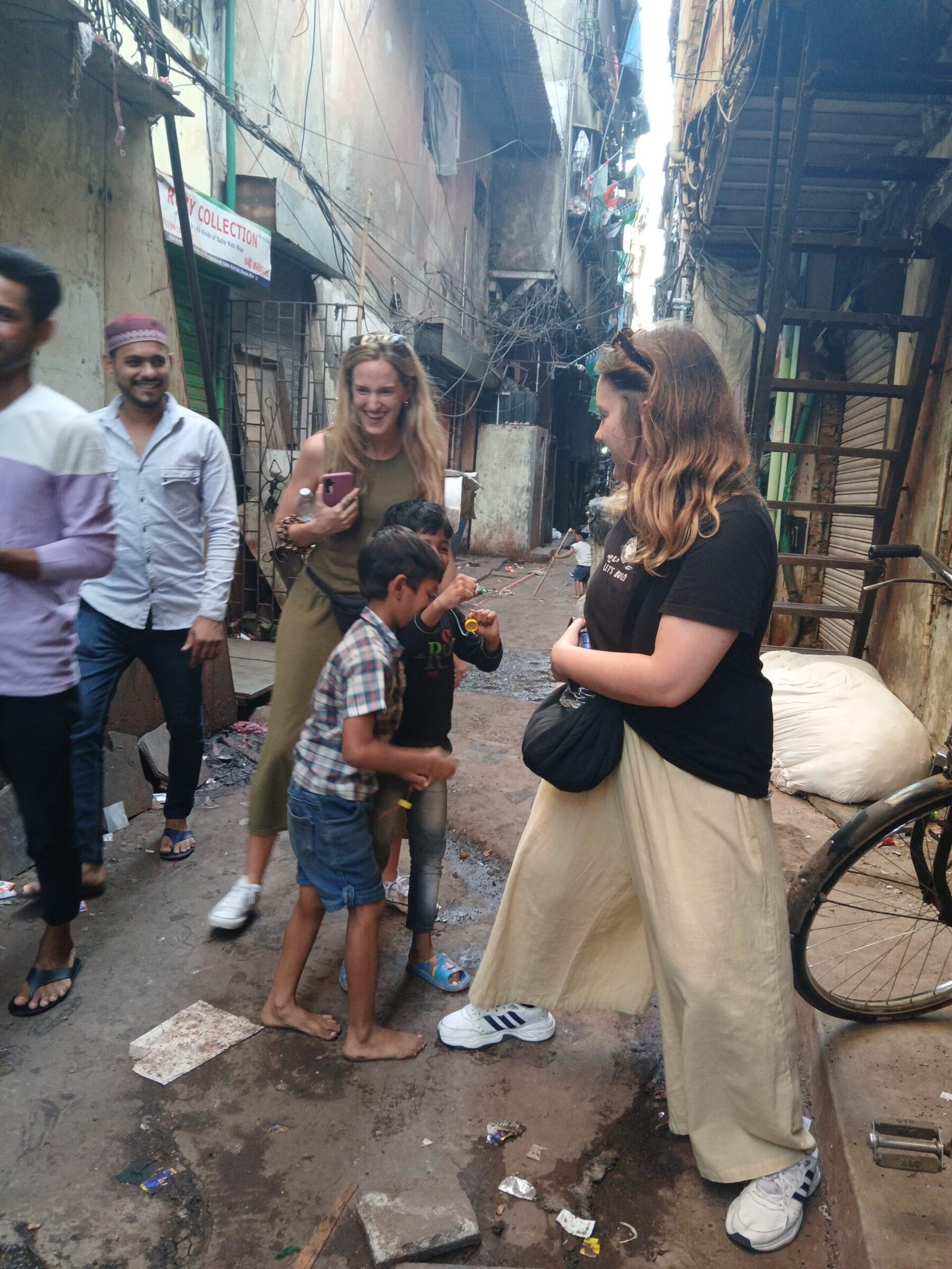 Guests sharing time with a family in Dharavi
