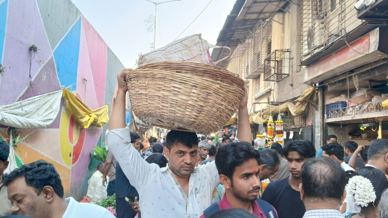 Vendors selling flowers at the Dadar flower market in Mumbai