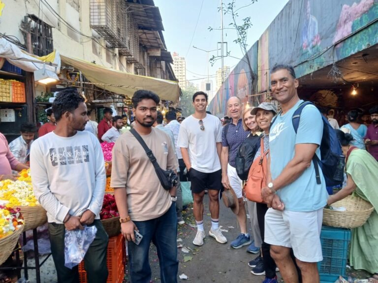 Dadar Flower market vendors selling flower with our guide - Mumbai Experiences