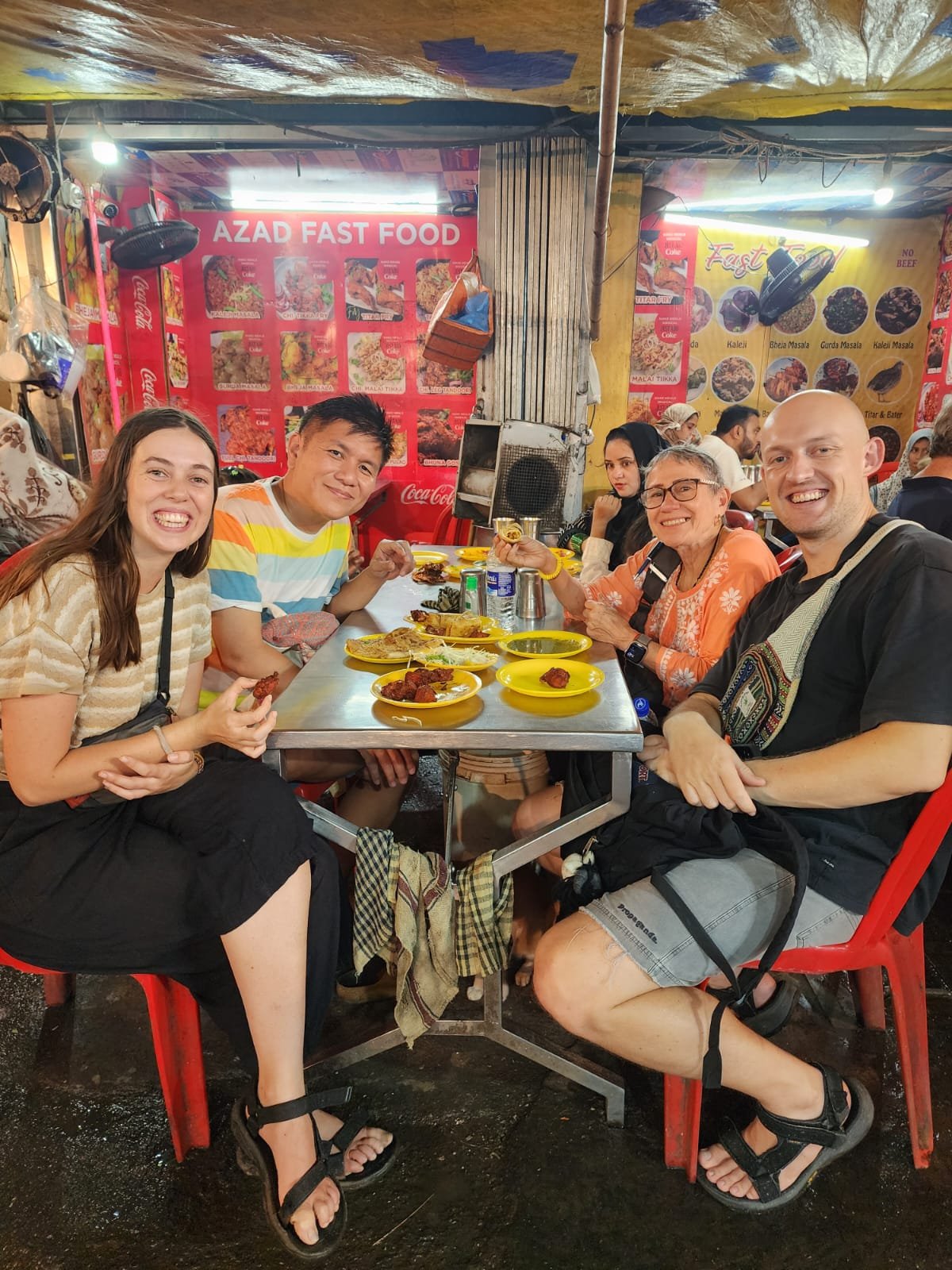 Guests on a Mumbai street food tour in the rain