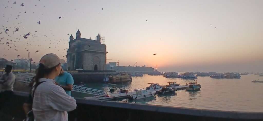 Sunrise over the water beside the Gateway of India, Mumbai, at the start of the dawn bicycle ride