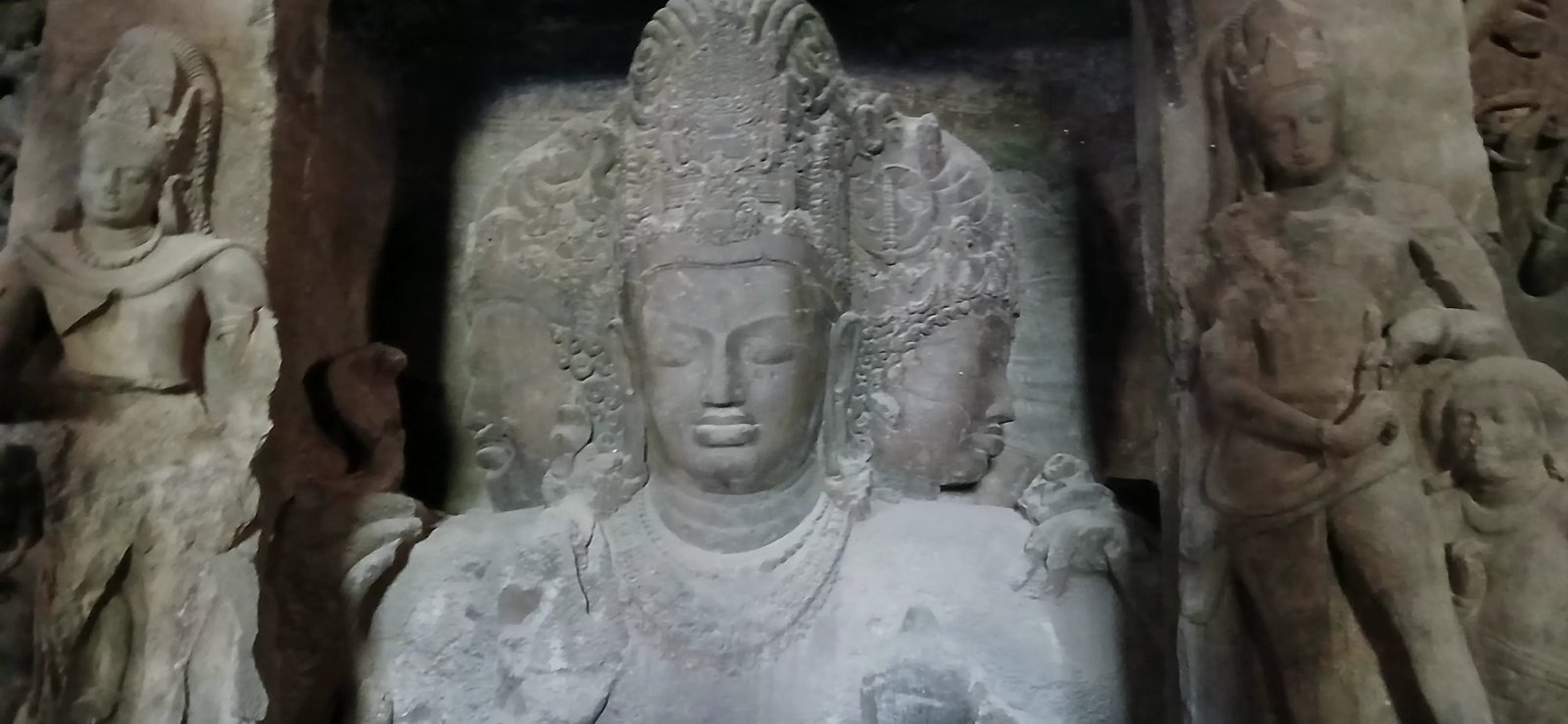 The Trimurti, a three-headed rock-cut sculpture of Shiva at Elephanta Caves, Mumbai