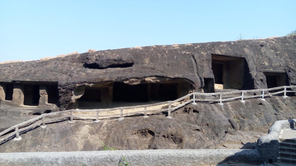 Caves cut in rows along the basalt hillside at Kanheri, inside Sanjay Gandhi National Park, Mumbai