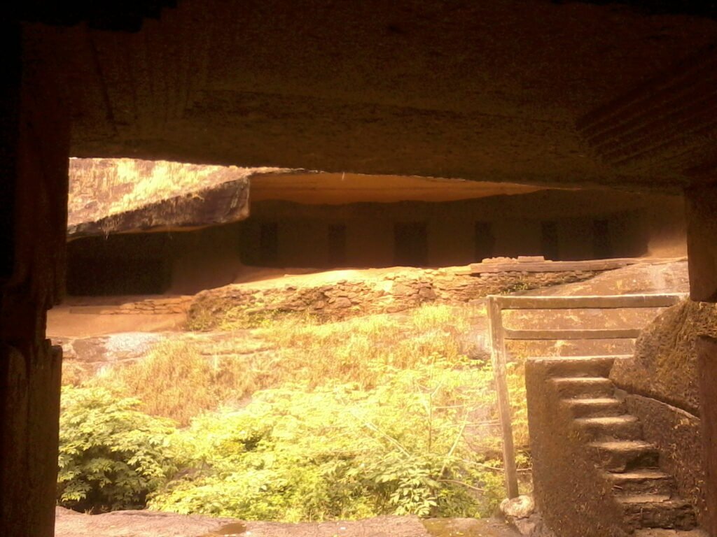 Looking out from inside a cave at Kanheri onto the forest and stone steps of Sanjay Gandhi National Park